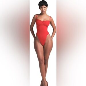 SKIMS Seamless Sculpt Lace-Trim Thong Bodysuit in Cayenne Limited Edition small